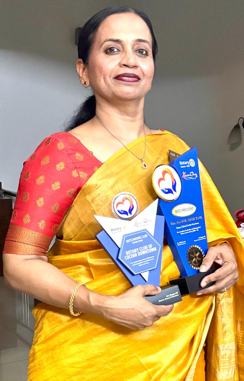 IPP Susie Paul holding Rotary awards